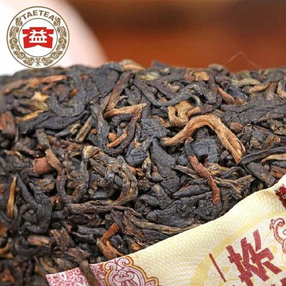 Close up of a Dayi Menghai tea factory ripe Puerh Tuo with no wrapper