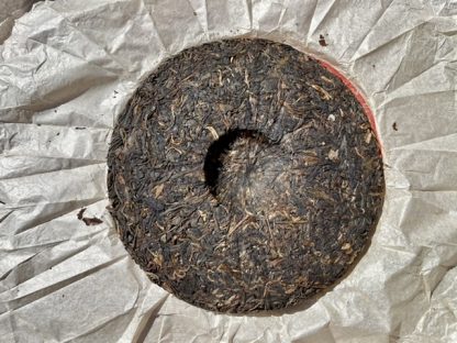 The back of an open wrapper, aged raw puerh tea cake