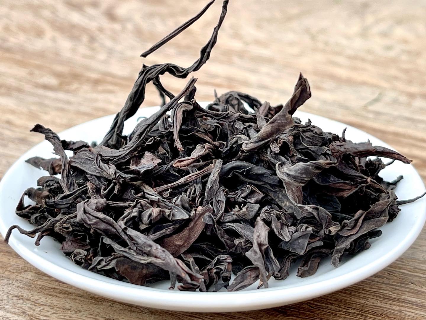 Rougui Yancha oolong tea leaves in a bowl on the table