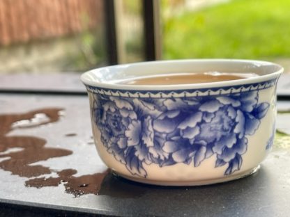 A cup of tea on a Chinese tea table outside
