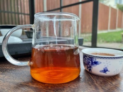 Lao Cong Shui Xian Yancha tea In a glass on a table